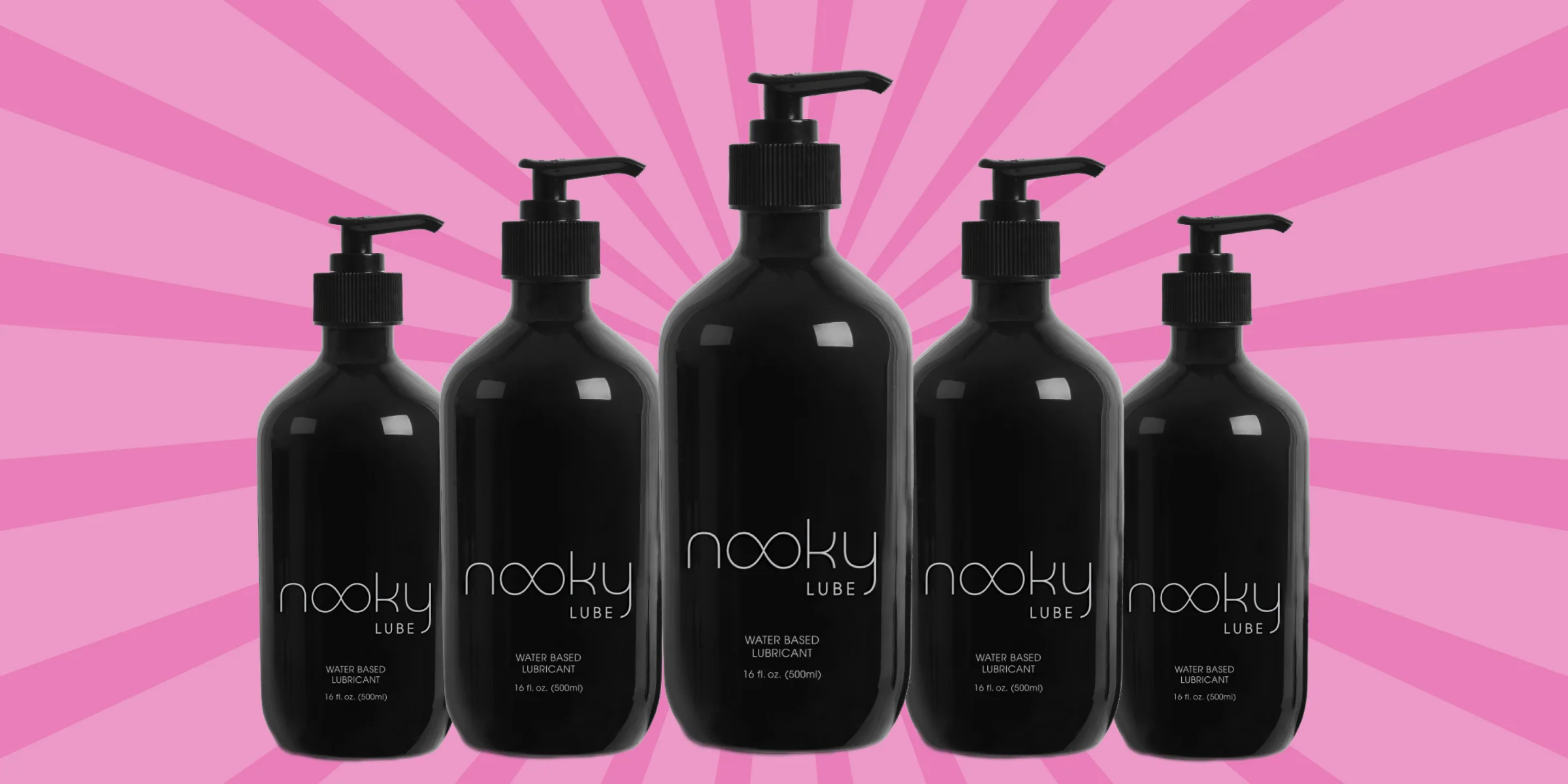 Five black bottles of Nooky water-based lube lined up on pastel stripes